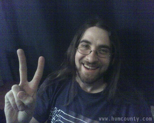 humboldt county hippie guy long hair glasses peace